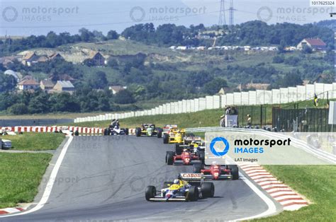 Nigel Mansell Williams FW11B Honda Leads Gerhard Berger Ferrari F1