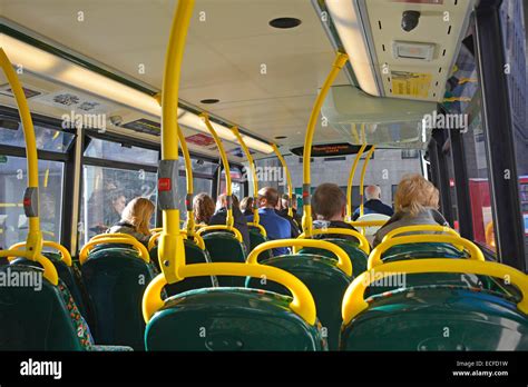 Interior Back View Of Passengers Seated On Upper Deck Of London Stock