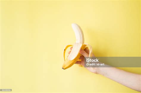 Human Hand Holding Banana Fruit Nutrition Concept Stock Photo