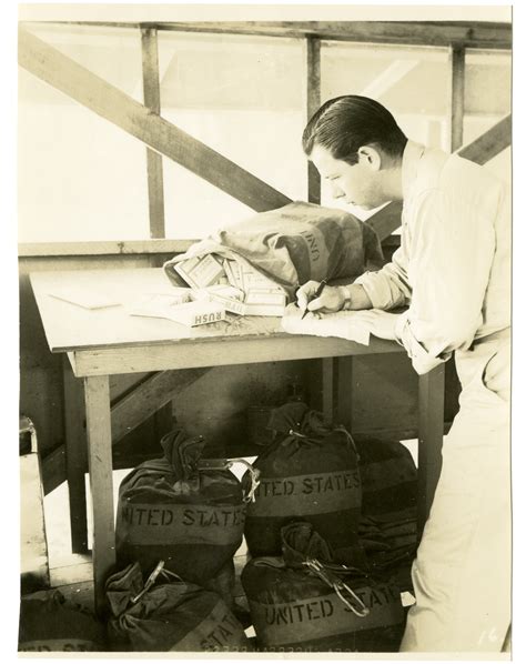 A Men Checks And Logs Rolls Of V Mail Film In Papua New Guinea In 1944