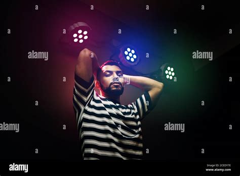 Handsome Bearded Man Dancing In Spotlight Stock Photo Alamy