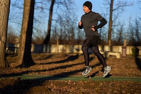Mature Man Running In The Park With Headphones Stock Photo Image Of