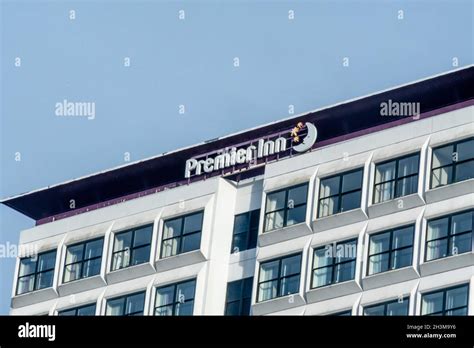 The Premier Inn signage at the top of their hotel building in Charing Cross, Glasgow Stock Photo ...