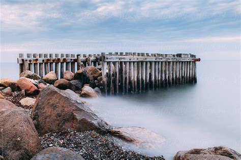 "Old Pier At Sunset" by Stocksy Contributor "R A V E N" - Stocksy