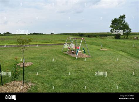 Swing Set In A Lawn Stock Photo Alamy