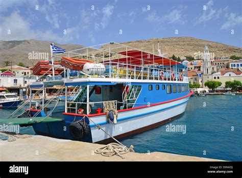 Ferry Boat On Waterfront Port Of Emporio Halki Chalki Rhodes