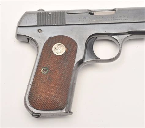 Colt Model 1903 Pocket Semi Automatic Pistol 32 Caliber 4” Barrel Blued Finish Checkered Wood