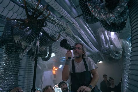 Fede Álvarez observing a Facehugger on the set of Alien Romulus Alien