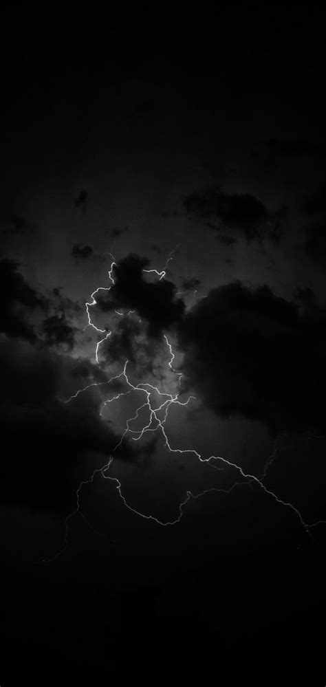 A Black And White Photo Of Lightning In The Sky