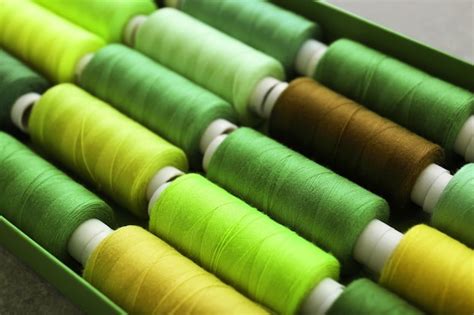 Premium Photo Green Sewing Threads Of Different Shades In Box