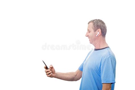 Smiling Middle Aged Man Using Smartphone Texting While Listening To