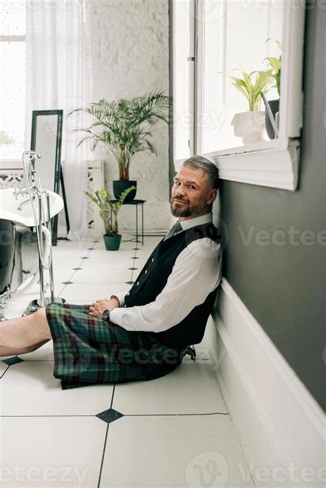 Handsome Mature Courageous Stylish Scotsman Businessman In Kilt And Suit In Bathroom Style
