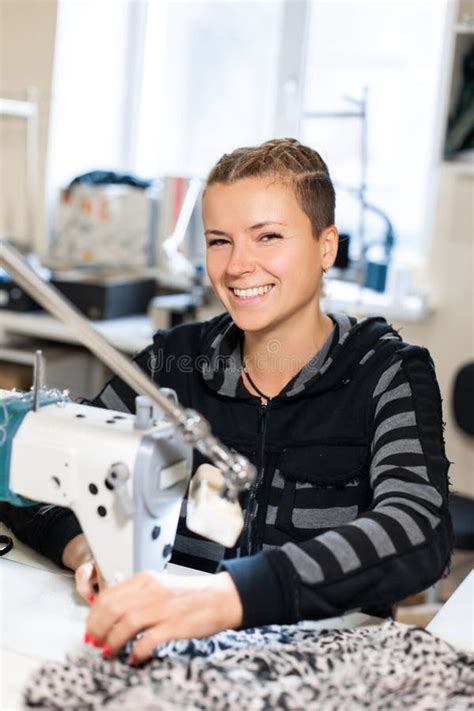 Seamstress Sewing At Machine Portrait Female Tailor Stitching