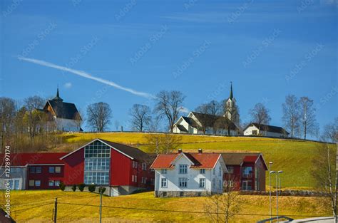 Lovely village in norway with church, and typical red houses, green ...