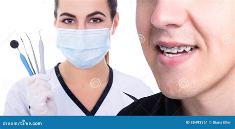 Dentist Or Orthodontist And Young Man With Braces On Teeth Stock Image