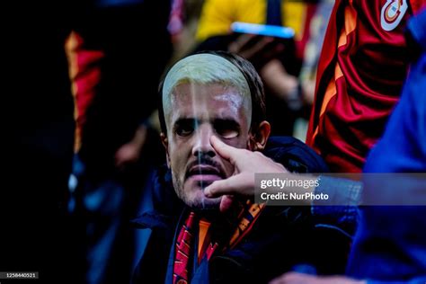 A young Galatasaray fan wearing a mask of Mauro Icardi is celebrating ...