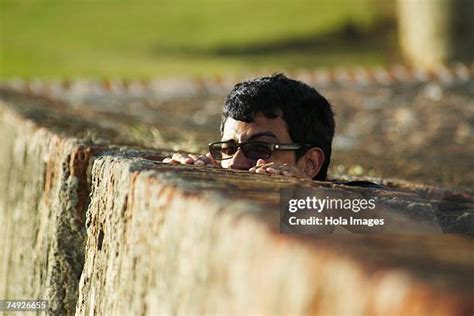 21 Man Peeking Over Fence Stock Photos High Res Pictures And Images