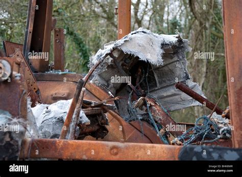 Burnt Out Stolen Tractor In A Countryside Lane Stock Photo Alamy