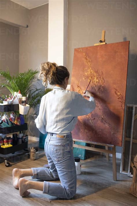 Young Woman Painting In Her Atelier Stock Photo