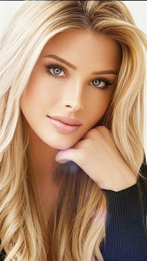 A Woman With Long Blonde Hair And Blue Eyes