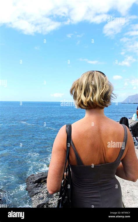 Mature Woman Rear View Looking At Sky Hi Res Stock Photography And