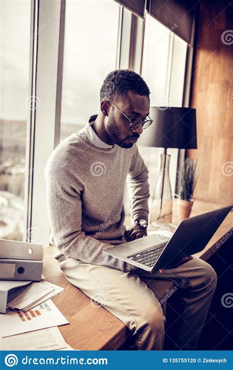 Serious Brunette Man Staring At His Laptop Stock Photo Image Of