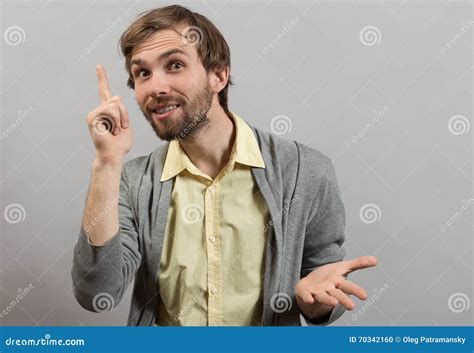 Young Man Pointing Up Having An Idea Stock Photo Image Of Showing