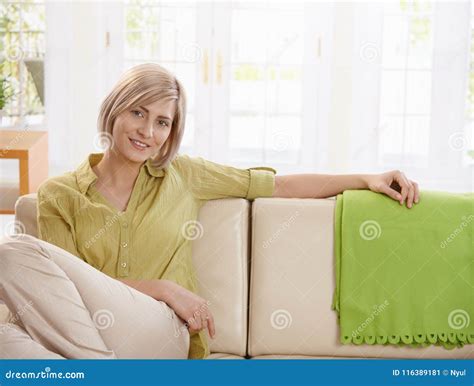 Woman Sitting On Sofa At Home Stock Image Image Of Blond European