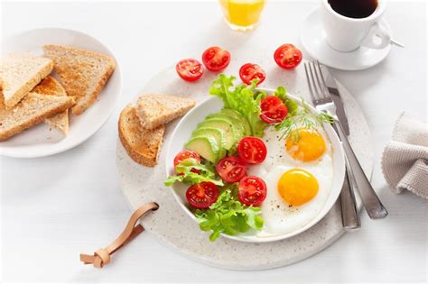 Premium Photo Healthy Breakfast With Fried Eggs Avocado Tomato