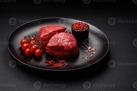 Fresh Juicy Raw Beef Medallions With Salt And Spices Stock