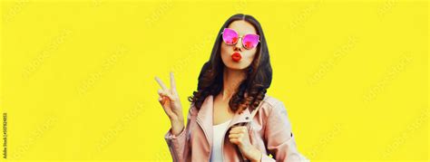 Portrait Of Beautiful Young Woman Blowing Her Lips Sending Air Kiss