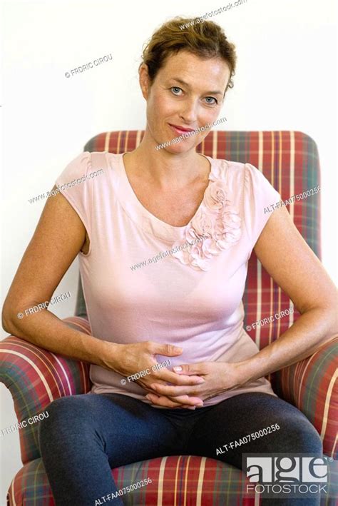 Mature Woman Sitting In Armchair Portrait Stock Photo Picture And Royalty Free Image Pic