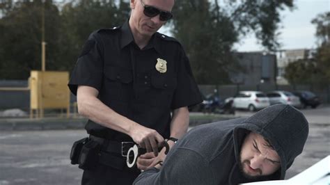 Police Officer Arresting Someone