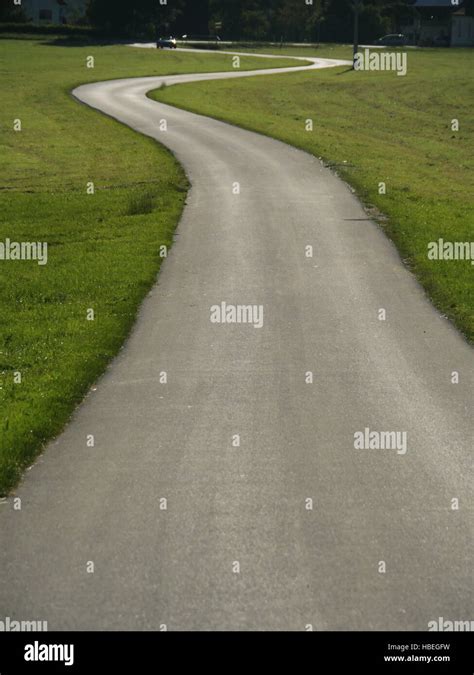 Car Driving On Curved Asphalt Road Stock Photo Alamy