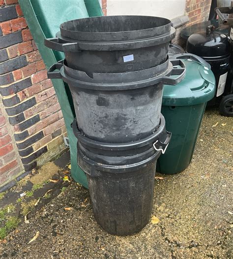 Stack Of Four Black Plastic Bins Badgers Auctions On Site And