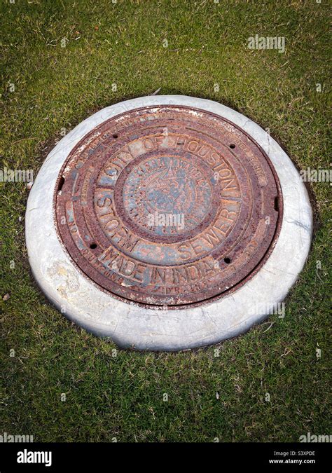 City Of Houston Rusty Sewer Storm Manhole Cover Stock Photo Alamy