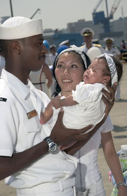 Us Navy Usn Seaman Sn Darrin Askins Holds His Daughter For The