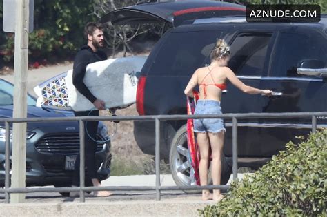 Miley Cyrus Sexy In A Cheeky Red Bikini With Boyfriend Liam Hemsworth In Malibu Aznude