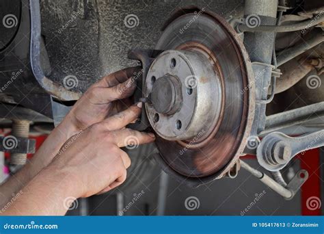 Car Mechanic Working On Disc Brakes Stock Image Image Of Servicing