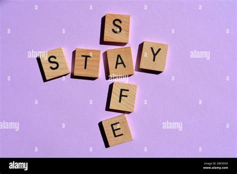 Stay Safe Crossword On Purple Background Stock Photo Alamy