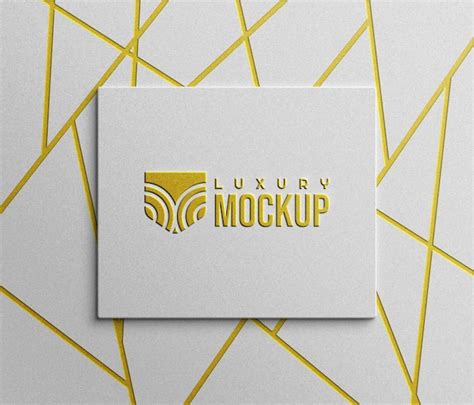 Design De Logotipo Dourado Em Relevo Psd Em Papel Branco PSD Premium