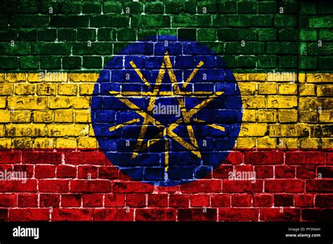 National Flag Of Ethiopia On A Brick Background Concept Image For