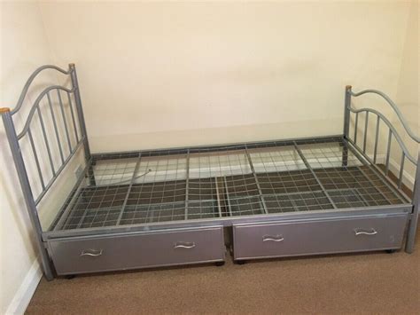 Single Metal Framed Bed With Two Large Storage Drawers On Wheels For