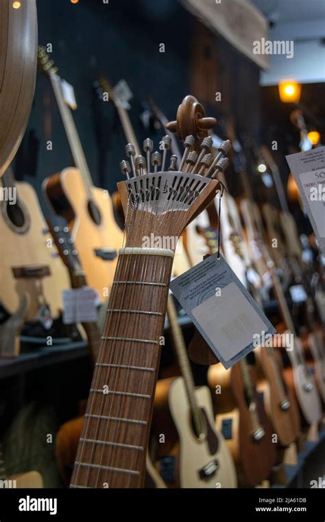 Musical instrument shop with acoustic guitars and Portuguese guitars ...