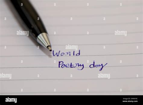 A Black Pen Rests On A Piece Of Lined Paper With Blue Ink The Words