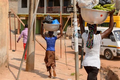 Unidentified Ghanaian Woman Carries A Basin On Her Head In Loca