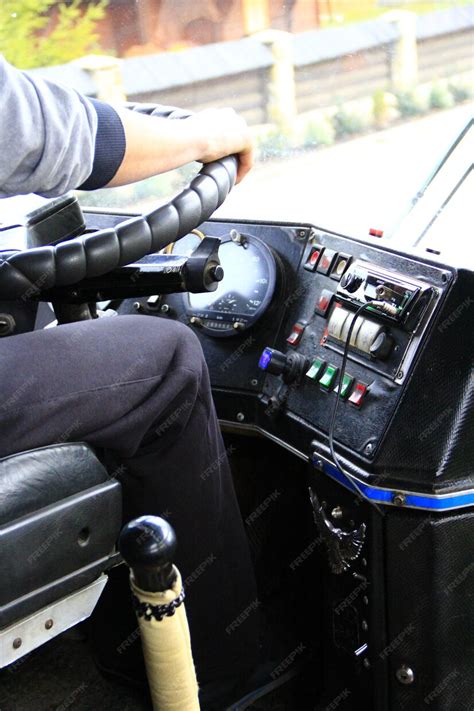 premium photo driver  driving bus driver switching gear lever