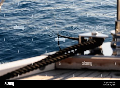 Detail Of Mooring Rope Around The Stainless Steel Bollard Of A Motor