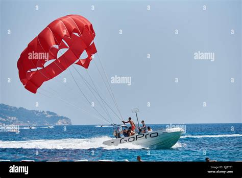 Boat With A Parachute For Parasailing Tourists In The Resort Town Stock