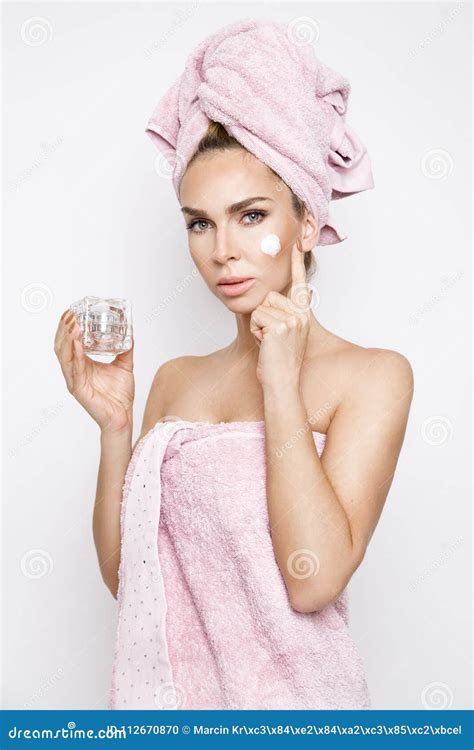 Beautiful Blonde Woman Holding A Cream In Her Hand Stock Photo Image Of Mask Cream